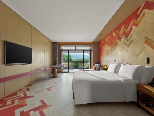 Imagen de la habitación del Hotel Angsana Tengchong. Foto 18
