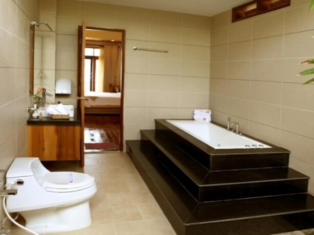 Imagen de la habitación del Hotel Aniise Villa Resort. Foto 24
