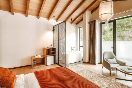 Imagen de la habitación del Hotel Anji Shanchuan Design Homestay. Foto 17