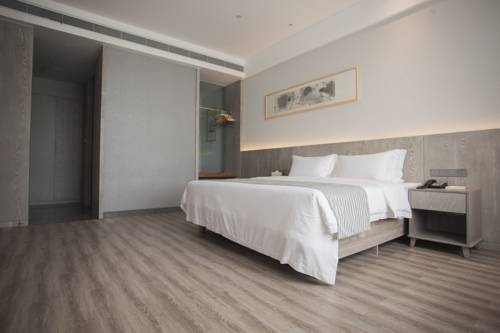 Imagen de la habitación del Hotel Ankang Lotus Flower Yaduo Collection. Foto 7