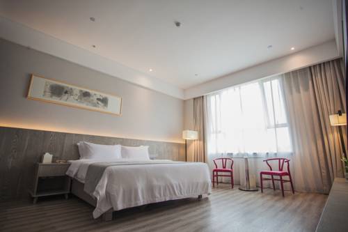 Imagen de la habitación del Hotel Ankang Lotus Flower Yaduo Collection. Foto 8