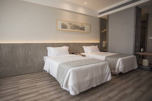 Imagen de la habitación del Hotel Ankang Lotus Flower Yaduo Collection. Foto 9