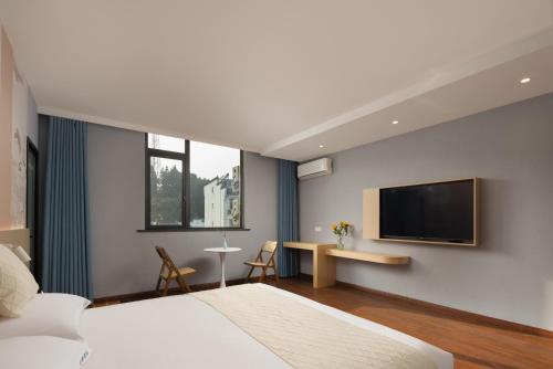 Imagen de la habitación del Hotel Anlan Shangrao Wuyuan Cultural Plaza. Foto 16