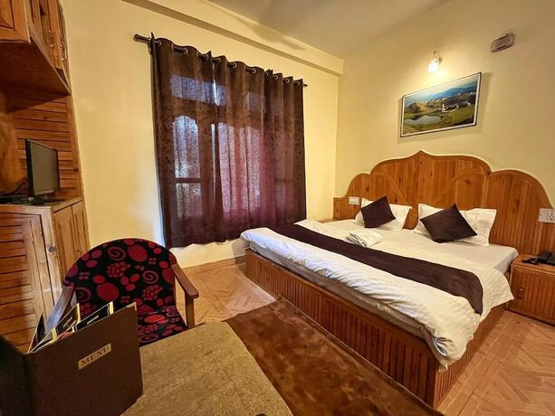 Imagen de la habitación del Hotel Anupam. Foto 24
