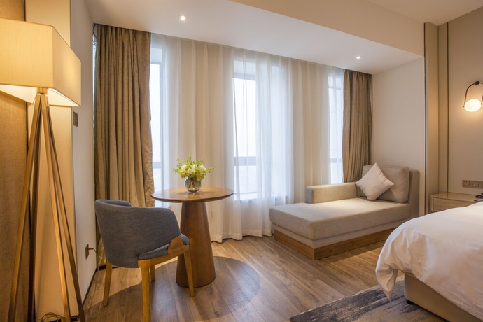 Imagen de la habitación del Hotel Aosheng Yiho. Foto 7