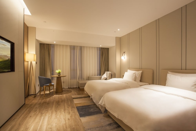 Imagen de la habitación del Hotel Aosheng Yiho. Foto 11