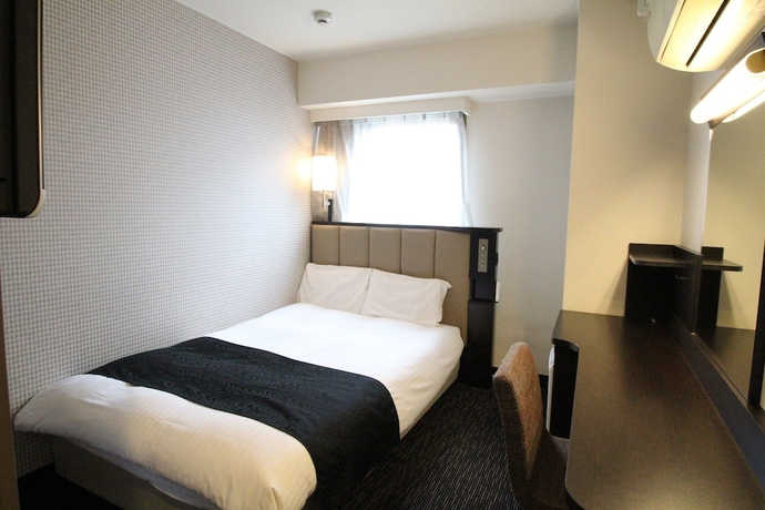 Imagen de la habitación del Hotel Apa Kumamoto Sakuramachi Bus Terminal Minami. Foto 2