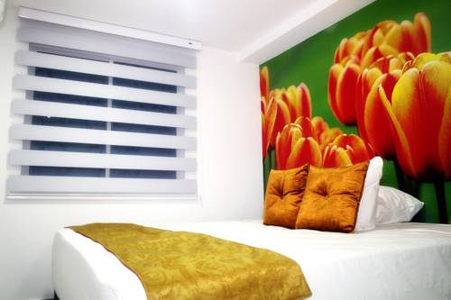 Imagen de la habitación del Hotel Apartahotel Tur&iacute;stico Jardines Del Caney. Foto 2