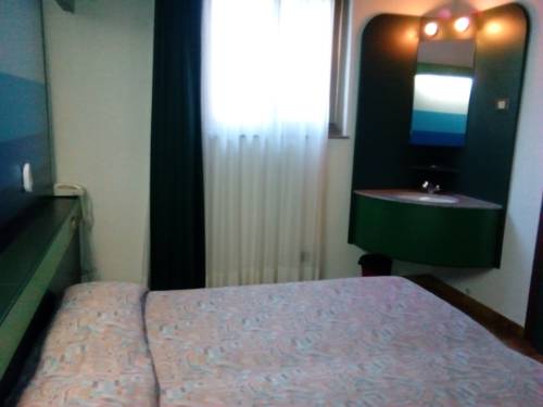 Imagen de la habitación del Hotel Apartamento Eco Village Baia delle Ginestre. Foto 9