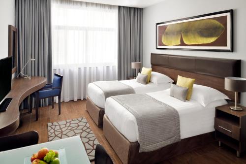 Imagen de la habitación del Hotel Apartamento Movenpick Apartments Al Mamzar Dubai. Foto 13