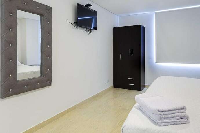 Imagen de la habitación del Hotel Apartasuite Galery FC. Foto 18