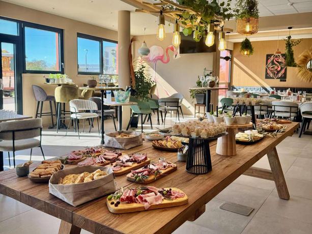 Imagen del bar/restaurante del Hotel Aparthotel Adagio Access Porte de Camargue. Foto 4