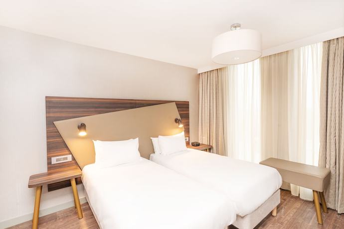 Imagen de la habitación del Hotel Aparthotel Adagio Leicester. Foto 10