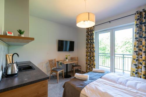 Imagen de la habitación del Hotel Aparthotel Pod Stokiem z sauną i jacuzzi - szczyrkapartamenty. Foto 15