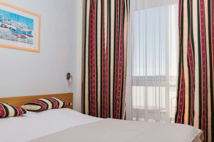 Imagen de la habitación del Hotel Aparthotel Roccia. Foto 15