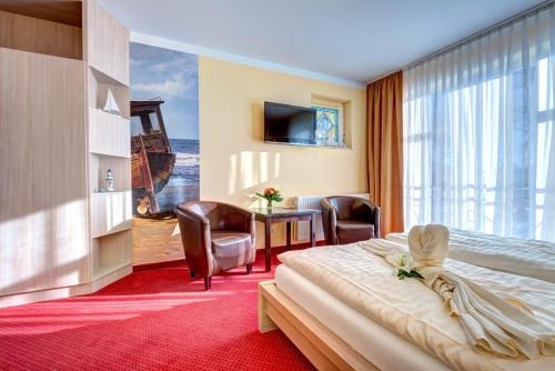 Imagen de la habitación del Hotel Aparthotel Strandhus. Foto 10