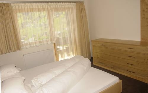 Imagen de la habitación del Hotel Aparthotel Tschanun Garni. Foto 50