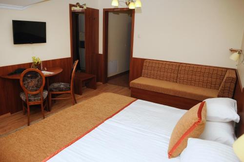 Imagen de la habitación del Hotel Apartman Bella. Foto 8