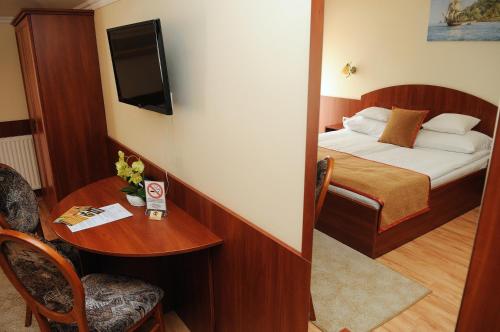Imagen de la habitación del Hotel Apartman Bella. Foto 9