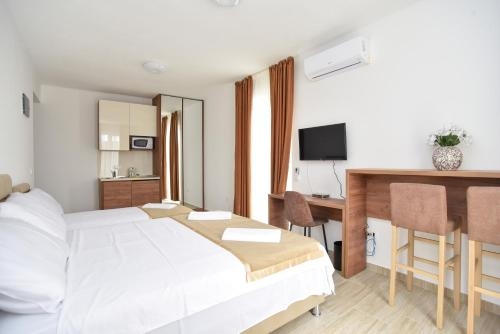 Imagen de la habitación del Hotel Apartment L Palace. Foto 6