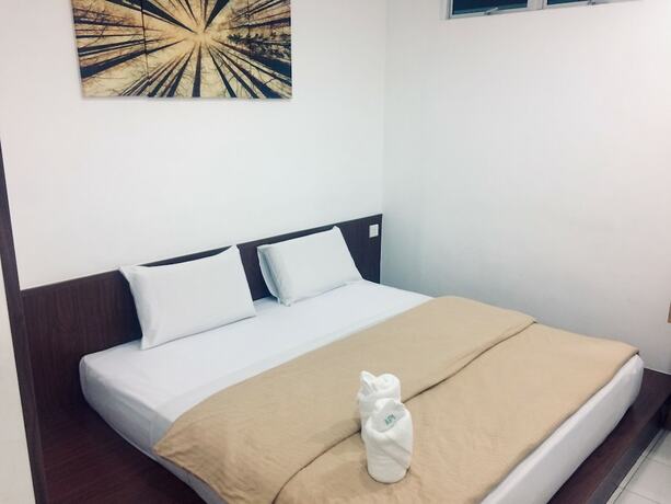 Imagen de la habitación del Hotel Api-Api Guest House. Foto 17