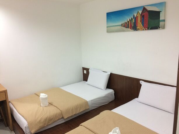 Imagen de la habitación del Hotel Api-Api Guest House. Foto 18