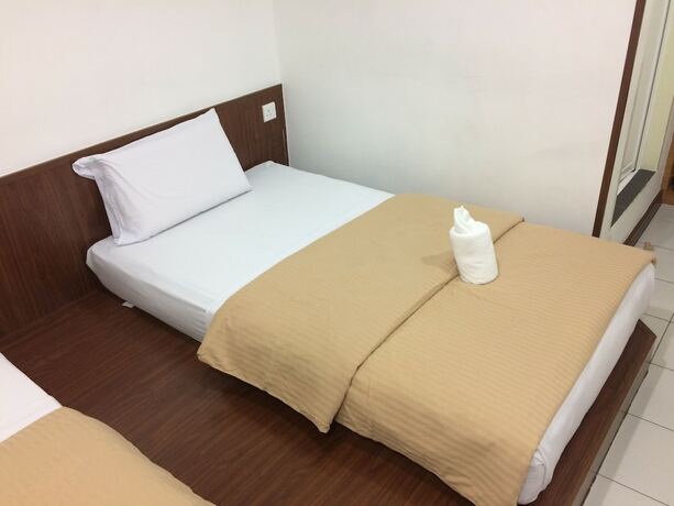 Imagen de la habitación del Hotel Api-Api Guest House. Foto 20