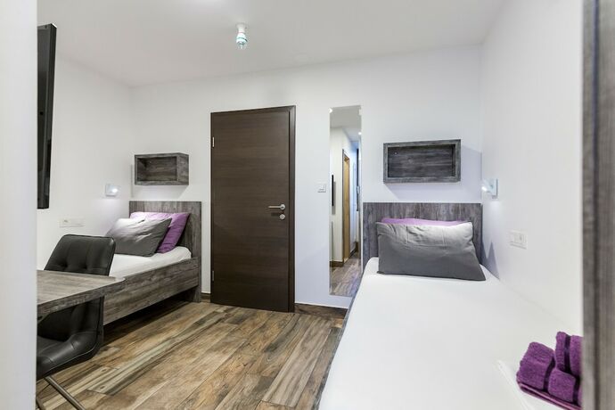 Imagen de la habitación del Hotel Apinelo Tower Rooms. Foto 17