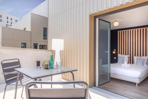 Imagen de la habitación del Hotel Appart H&ocirc;tel Le Monde Paris Pont d'ivry. Foto 19