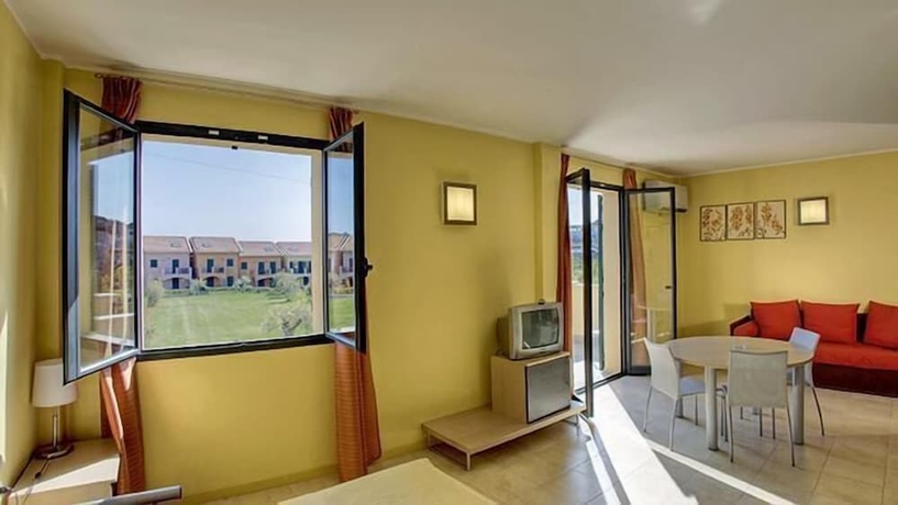 Imagen de la habitación del Hotel Appartamenti Castellaro. Foto 9