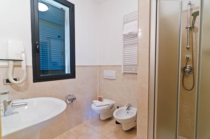Imagen de la habitación del Hotel Appartamenti Castellaro. Foto 13
