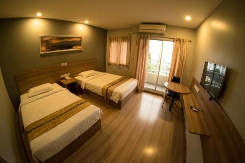 Imagen de la habitación del Hotel Apple Holiday. Foto 6