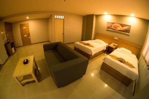 Imagen de la habitación del Hotel Apple Holiday. Foto 8