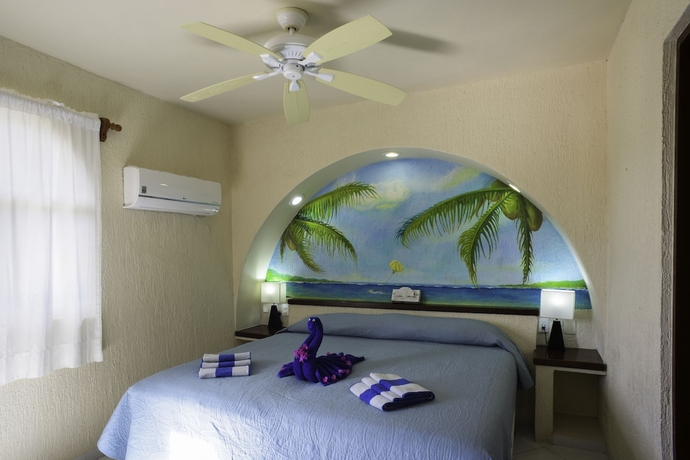 Imagen de la habitación del Hotel Aquatech Villas Derosa Resort. Foto 5
