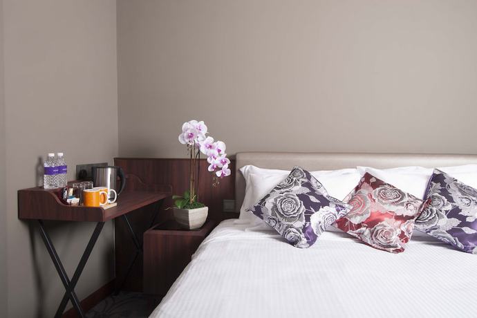 Imagen de la habitación del Hotel Aqueen Joo Chiat. Foto 2