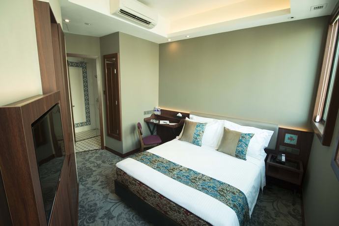Imagen de la habitación del Hotel Aqueen Joo Chiat. Foto 7