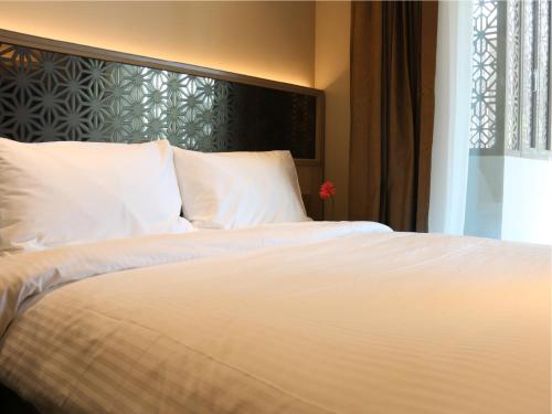 Imagen de la habitación del Hotel Aqueen Prestige Jalan Besar. Foto 13