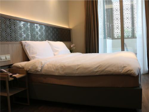 Imagen de la habitación del Hotel Aqueen Prestige Jalan Besar. Foto 14