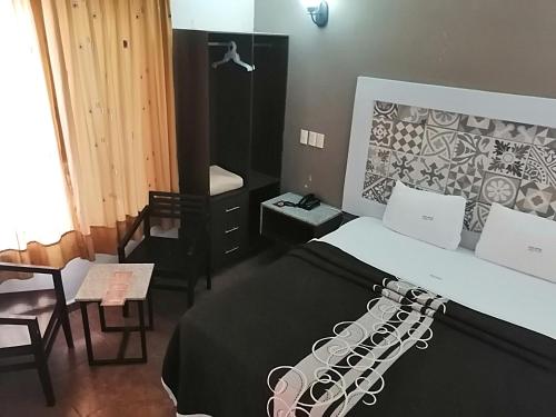 Imagen de la habitación del Hotel Aquiles. Foto 18