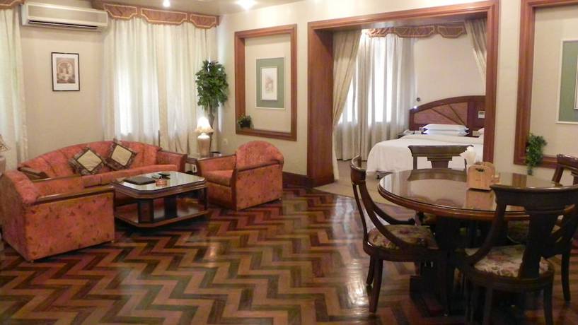 Imagen de la habitación del Hotel Aram, Jamnagar. Foto 7