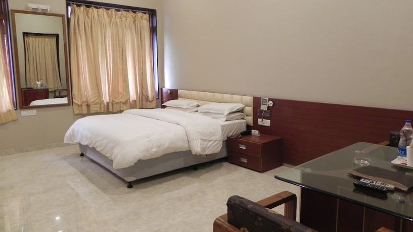 Imagen de la habitación del Hotel Aram, Jamnagar. Foto 14
