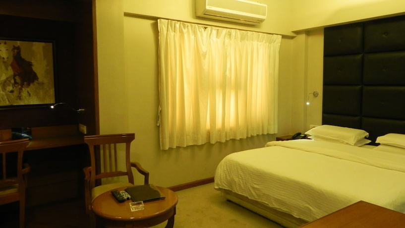 Imagen de la habitación del Hotel Aram, Jamnagar. Foto 16