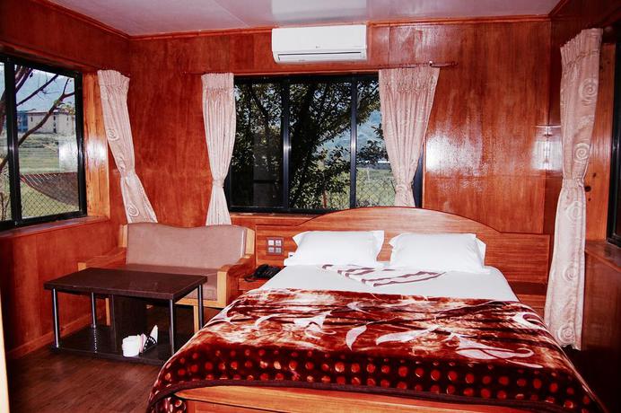 Imagen de la habitación del Hotel Araniko Village Resort. Foto 4