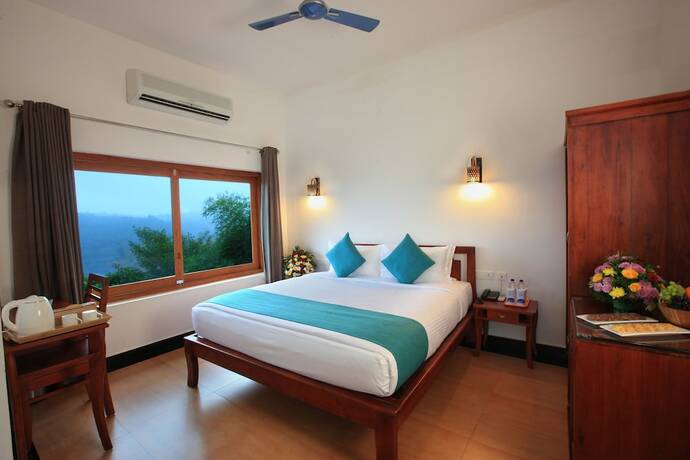 Imagen de la habitación del Hotel Arayal Resorts: A Unit of Sharoy Resort, Wayanad. Foto 15