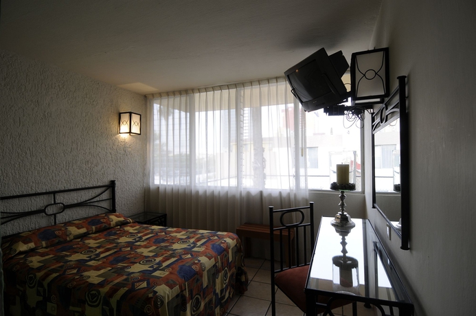 Imagen de la habitación del Hotel Arboledas Expo. Foto 3