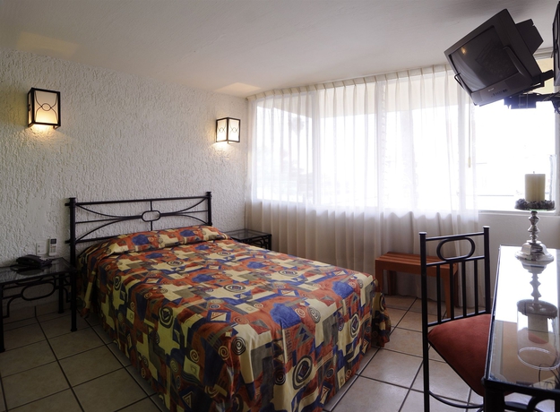 Imagen de la habitación del Hotel Arboledas Expo. Foto 4