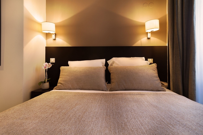 Imagen de la habitación del Hotel Arc Elysees. Foto 8