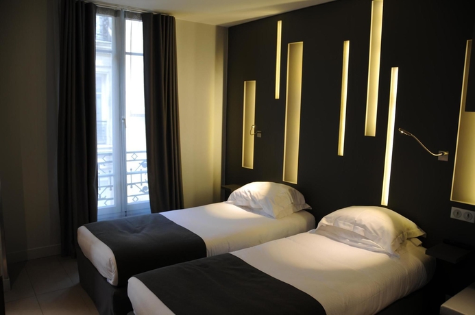 Imagen de la habitación del Hotel Arc de Triomphe Etoile. Foto 11