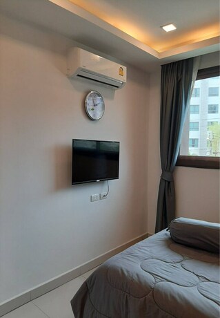 Imagen de la habitación del Hotel Arcadia Beach Condo By Jiabo. Foto 21