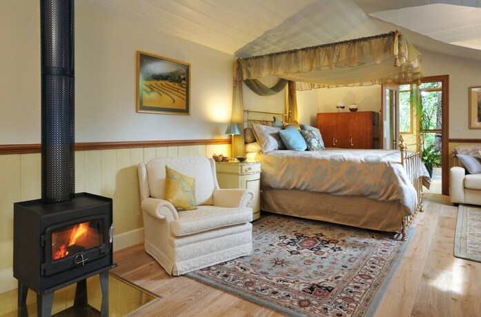 Imagen de la habitación del Hotel Arcadia Cottages. Foto 10